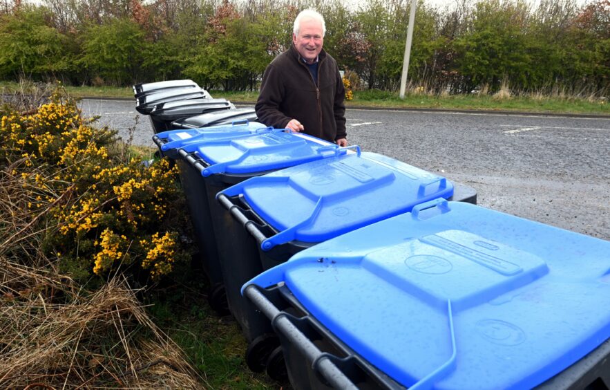 Councillor Colin Pike and some Aberdeenshire bins. 