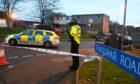 Police at the scene of one of the attacks in Balnagask Road in January last year. Image: DC Thomson