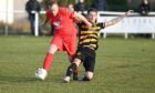 Stoneywood's Daniel Milne and Stonehaven's Wayne Barron compete for the ball