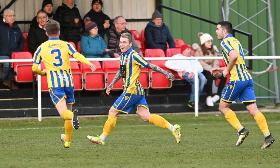 Inverurie Locos forward Robert Ward celebrates scoring against Formartine