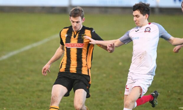 Andy Hunter, left, playing for Huntly as a trialist against Turriff