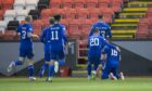 Iain Vigurs is congratulated by Cove Rangers team-mates after bagging the winner. Photo by Dave Cowe