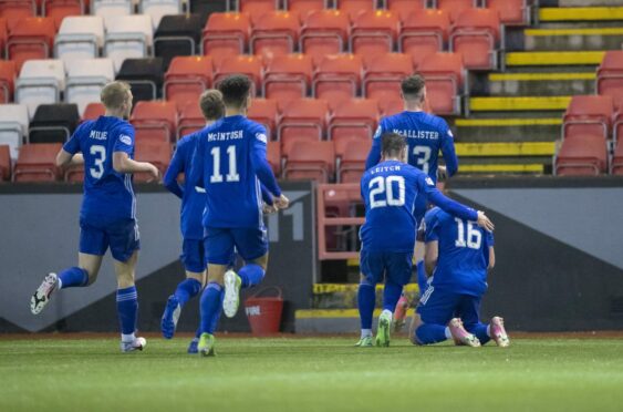 Iain Vigurs is congratulated by Cove Rangers team-mates after bagging the winner. Photo by Dave Cowe