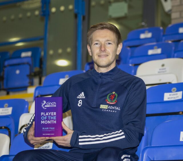 Cove Rangers midfielder Blair Yule with the League One player of the month award for December. Photo by Dave Cowe
