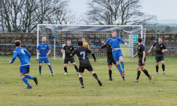 Midfield action from Golspie Sutherland's 2-1 win against Loch Ness last weekend.  Picture by David Jefferson