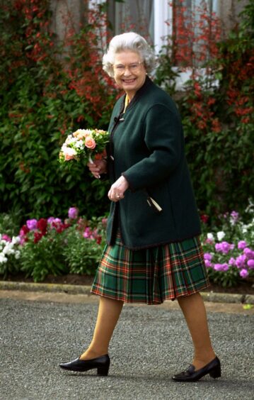 The Queen adopts a more casual approach while at Balmoral.