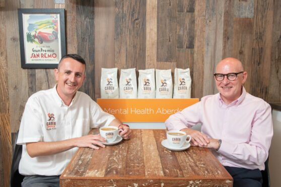 Managing Director of Caber Coffee, Findlay Leask (left) and Mental Health Aberdeen (MHA) Chief Executive, Graeme Kinghorn (right) with 'Spill the Beans' coffee.