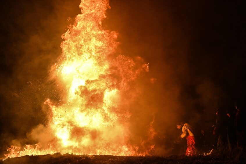 The Clavie ablaze on Doorie Hill. Photo: Jason Hedges/DCT Media