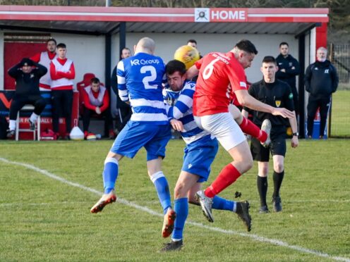 Gordon Russell and Graeme Wilson of Dyce challenge Culter's Darren Reid.