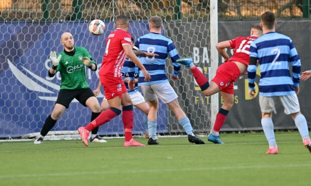 Banks o' Dee goalkeeper Fraser Hobday saves Tom Lang's header from point-blank range during first half injury time. Picture by Kath Flannery