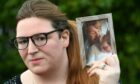 Amy Hessen holds photograph of mum Fiona Murphy who died on day of Downing Street drinks party.
