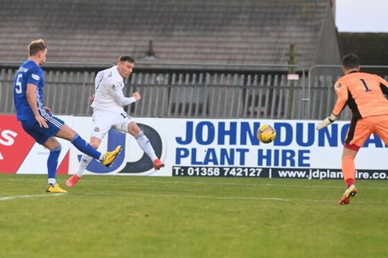 Cove Rangers striker Rory McAllister takes aim at the Peterhead goal