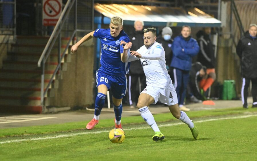 Ryan Duncan, left, in action for Peterhead against Cove Rangers