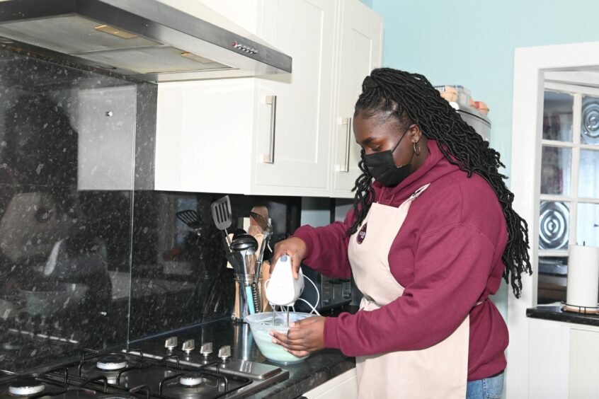 Lois Owusu-Afriyie runs her own baking business, Lois Caked It, from her home kitchen.