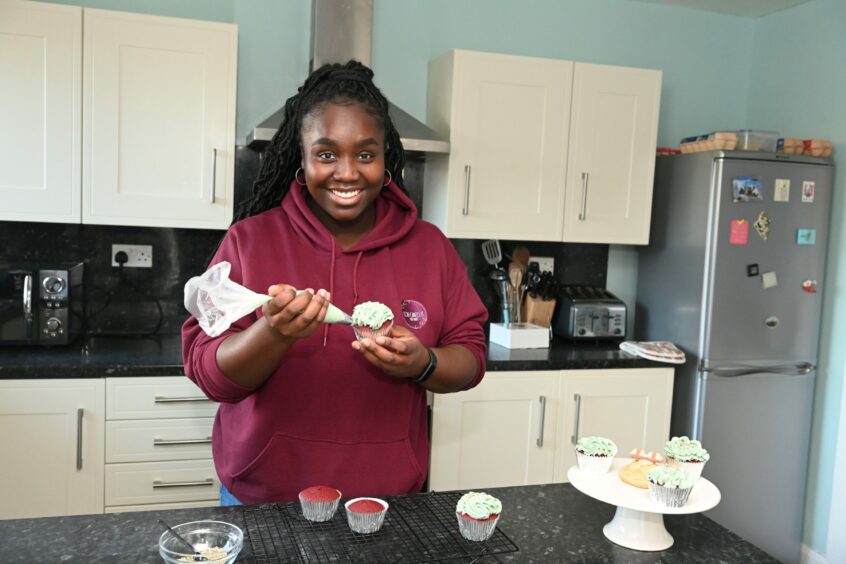 Lois Owusu-Afriyie runs her own baking business, Lois Caked It, from her home kitchen.