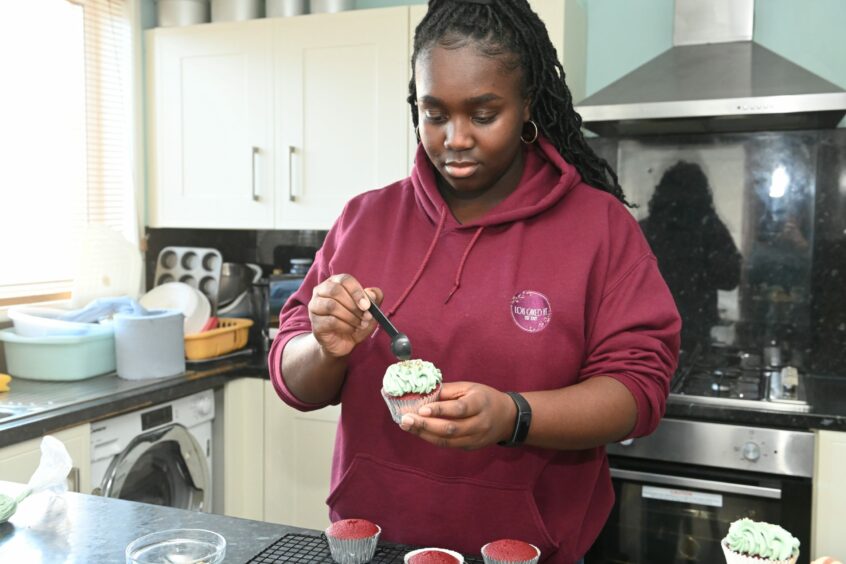 Lois Owusu-Afriyie runs her own baking business, Lois Caked It, from her home kitchen.