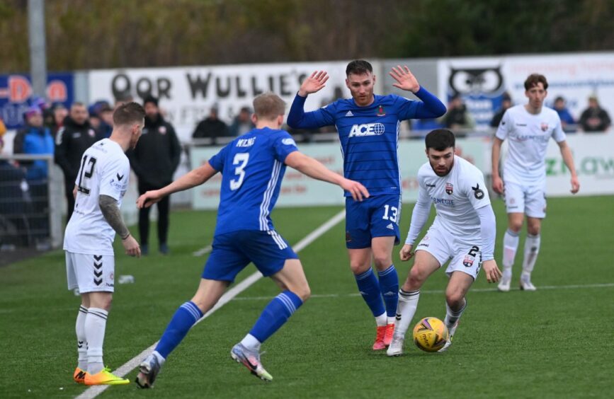 Montrose's Cammy Ballantyne goes up against Cove Rangers pair Rory McAllister and Harry Milne