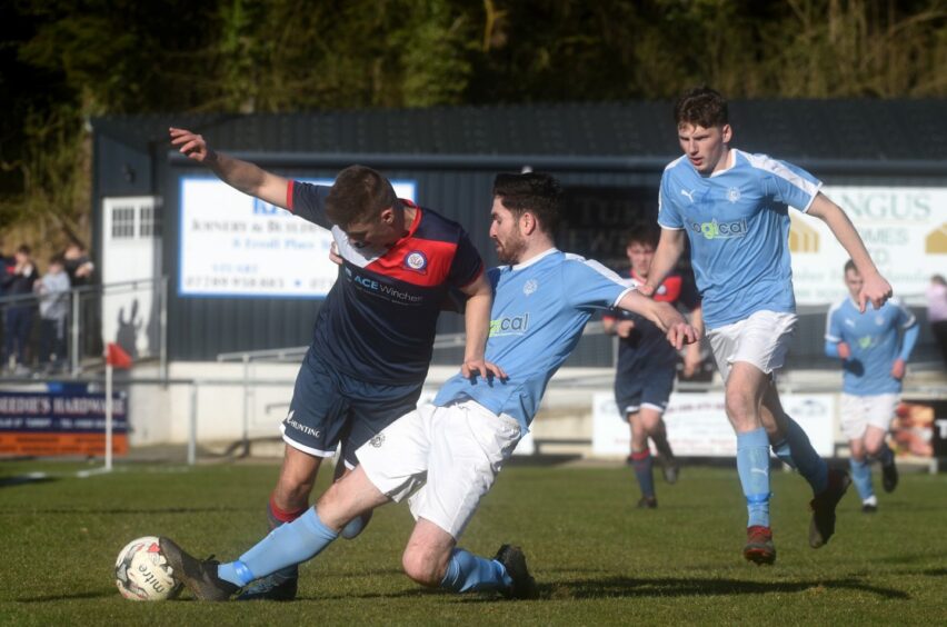 Callum Maclean, centre, in action for Nairn County
