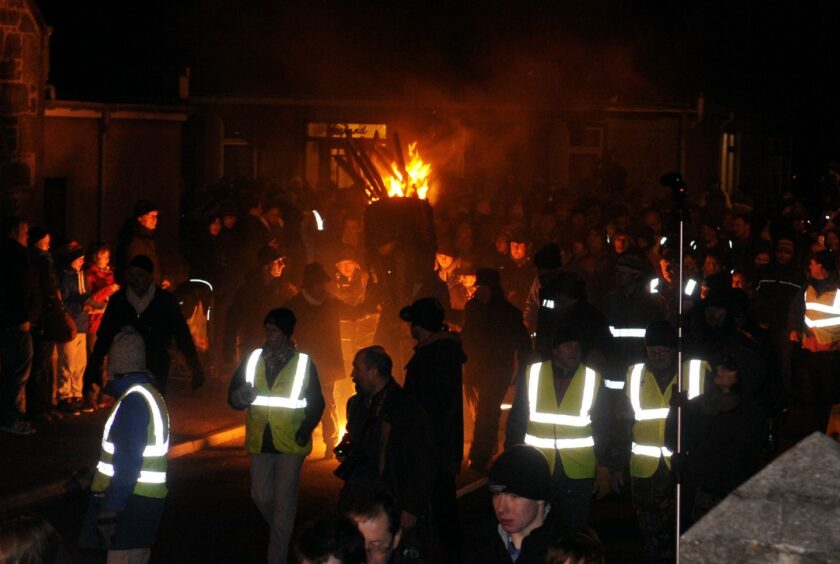 Flames and smoke add to the atmosphere of Clavie night in Burghead. Photo: Jason Hedges/DCT Media