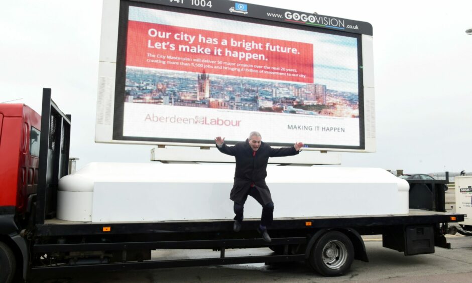 Willie Young at the launch of Aberdeen Labour's 2017 council manifesto. 'Making It Happen', as seen on the billboard, has become one of his most-used phrases on Twitter. Picture by Kami Thomson/DCT Media.