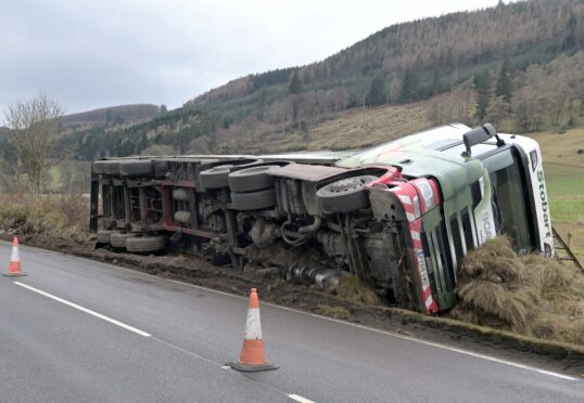 The lorry on its side. Picture by Sandy McCook