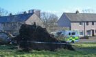 A cordon has been placed around Deveron Road following the death of a 60-year-old woman.