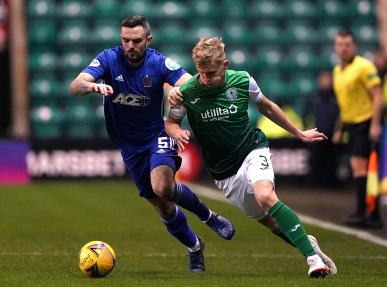 Cove Rangers' Scott Ross (left) gets to grips with Josh Doig