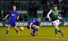 Hibernian striker Kevin Nisbet squeezes in the only goal of the game to edge out Cove Rangers