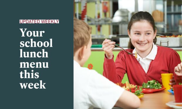 A girl in school uniform eating her lunch