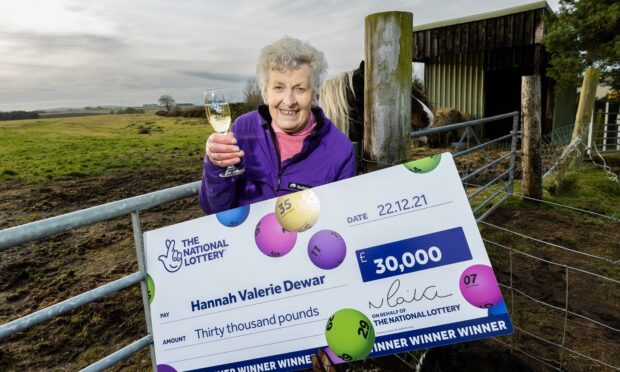 Val Dewar, 79, won the jackpot on a National Lottery scratchcard securing £30,000 in cash and a luxury BMW X2.