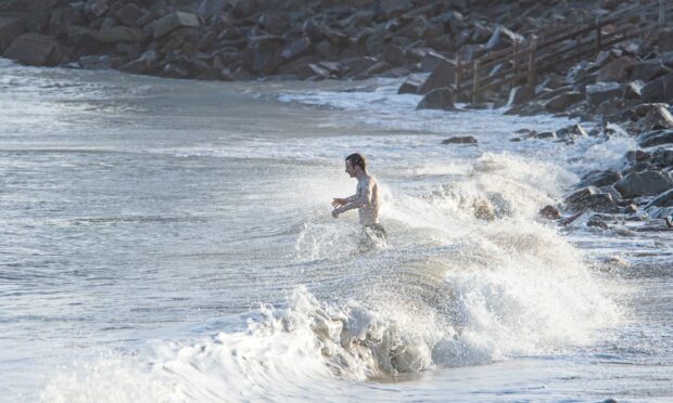 A hardy swimmer goes for a New Year dip in Aberdeen. Picture by Wullie Marr / DCT Media.