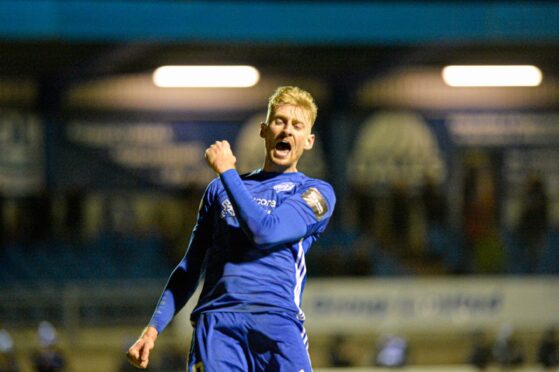 Peterhead striker Russell McLean celebrates scoring the winning penalty against East Kilbride