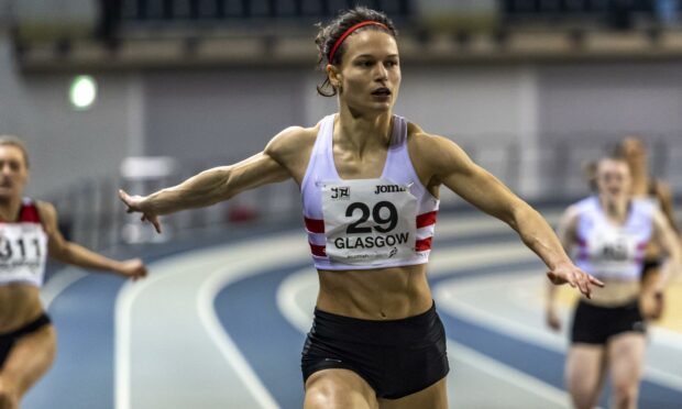 Zoey Clark set a new Scottish indoor 200m record at the Emirates Arena in Glasgow.