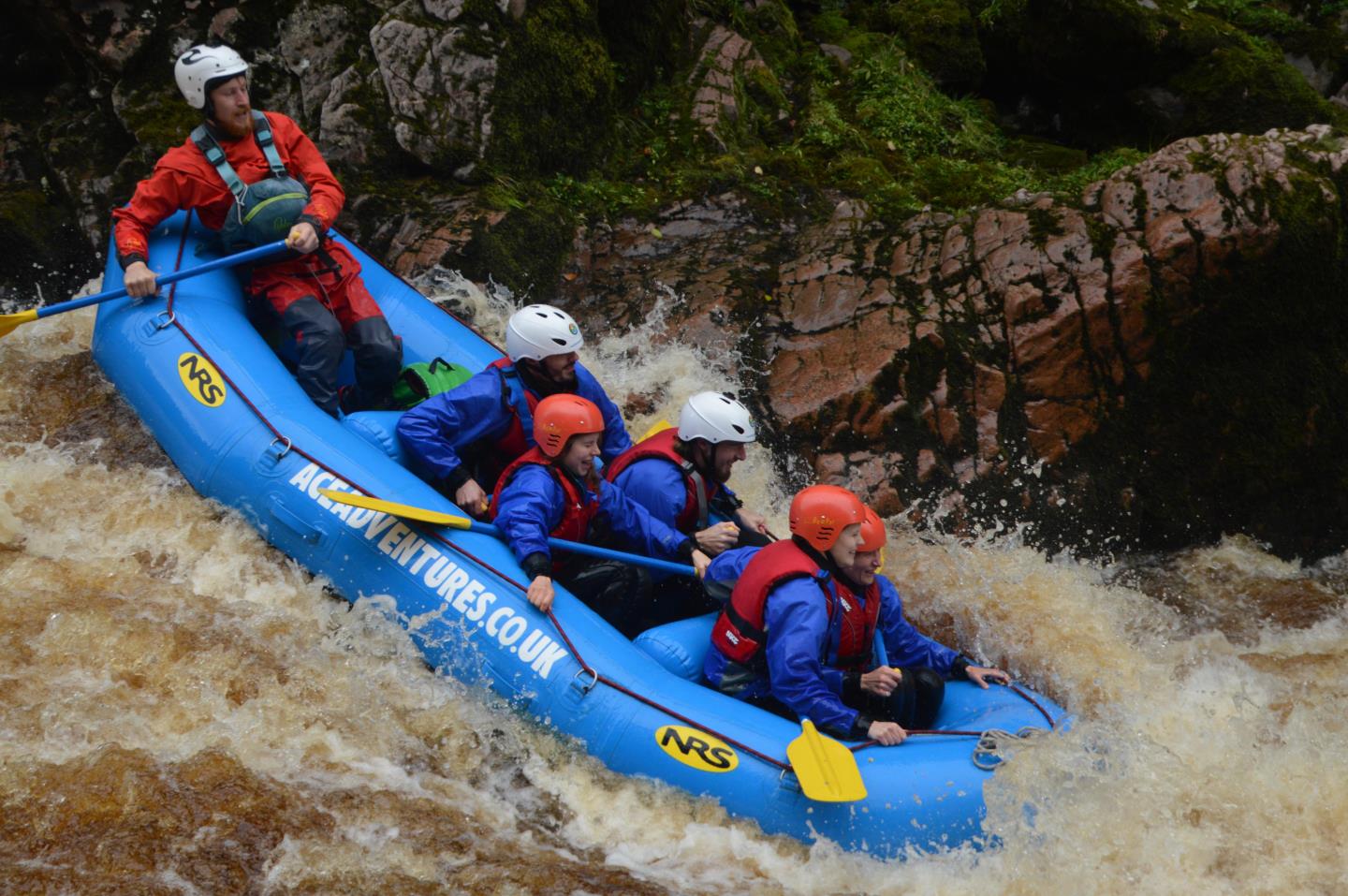 Family white water rafting in Moray, Scotland