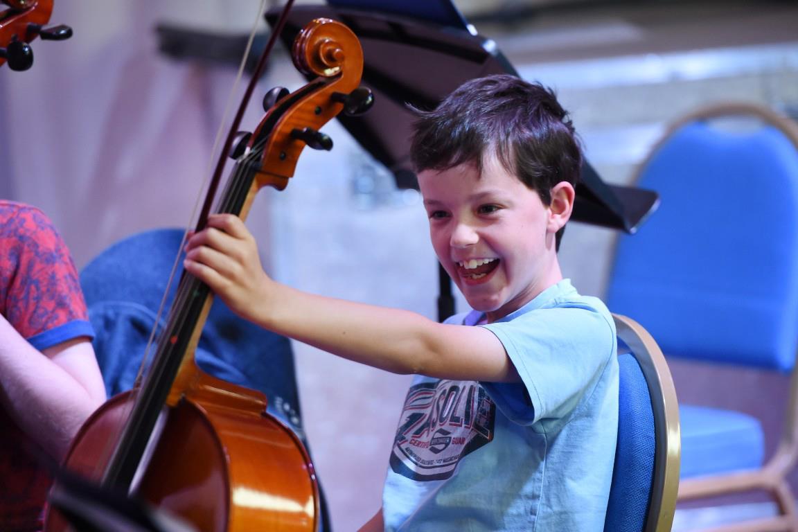 Participant in Scotland's national youth orchestra with a cello