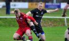 Invergordon's Kyle MacLean, right, in action against Inverness Athletic's Luke Mackay