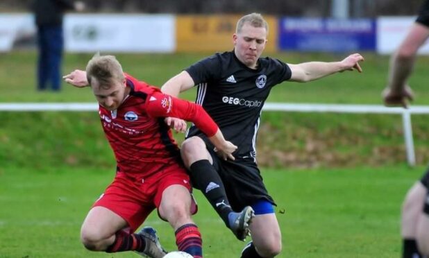 Invergordon's Kyle MacLean, right, in action against Inverness Athletic's Luke Mackay earlier this month. Picture by SW Photo/Stuart Wilson