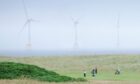 Donald Trump called wind turbines, like ones visible from his Aberdeenshire golf course, 'ugly monsters'. Image: Shutterstock.