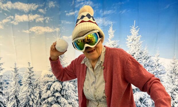 Resident Anne MacDonald, 89, loved the snowball throwing game. Image supplied.