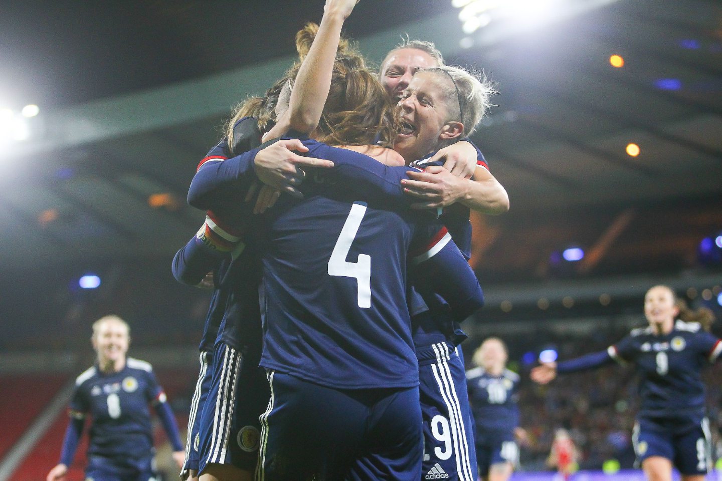 The Scotland team celebrating with teammates during the world cup