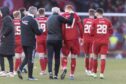 Aberdeen manager Jim Goodwin puts his arm around Aberdeen's David Bates (27) after the Premiership match at Pittodrie.