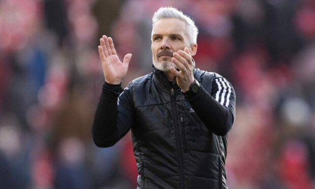 Aberdeen manager Jim Goodwin applauds the fans after the 1-1 draw with Dundee United.