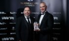Stats Group's Ron James, right, takes trophy for global export from David Rennie, Head of energy and low carbon transition, Scottish Development International, at Subsea UK's annual awards in Aberdeen. Photo by Ross Johnston/Newsline Media