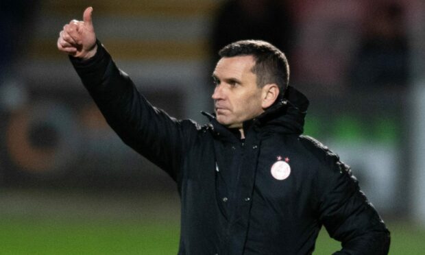 Aberdeen manager Stephen Glass gives instructions to his players