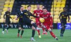 Livingston's Jack Fitzwater clears the ball away from Aberdeen's Christian Ramirez