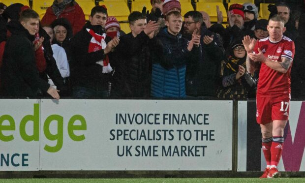 Aberdeen's Johnny Hayes applauds the travelling away fans during a cinch Premiership match between Livingston and Aberdeen at the Tony Macaroni Arena, on February 05, 2022.