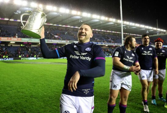 Yes, he did it again. Finn Russell celebrates with the Calcutta Cup.