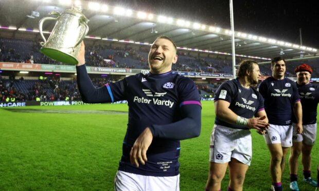 Yes, he did it again. Finn Russell celebrates with the Calcutta Cup.