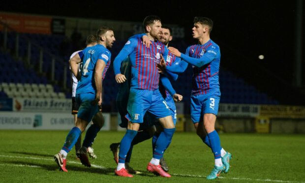 Kirk Broadfoot is congratulated after helping Caley Thistle to a late leveller