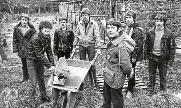 1982 - Principal teacher of technical subjects Alex Cowie with pupils converting a forester’s cottage